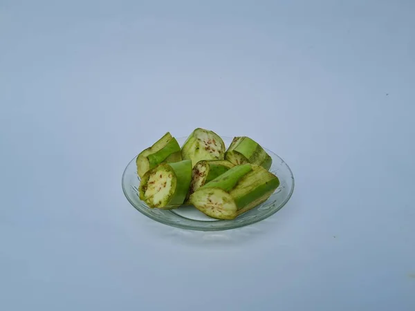 Slices Green Eggplant Isolated White Blue Combination — Fotografie, imagine de stoc