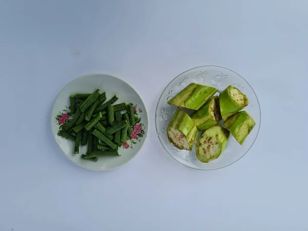 Slices Green Eggplant Green Beans Isolated White Blue Combination — Stock fotografie