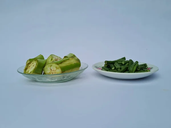 Slices Green Eggplant Green Beans Isolated White Blue Combination — Stock fotografie