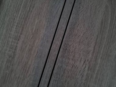 Soyut arka plan desenli kahverengi ahşap kapı ve siyah çizgiler.