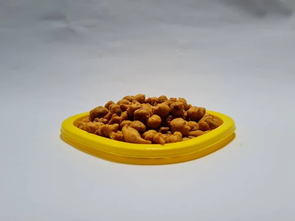 Brown Fried Peanuts Savory Taste Yellow Container — стоковое фото