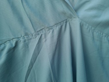 Soyut ve dokulu arkaplan katlanmış açık yeşil renkli kumaş