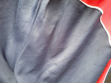 Mavi ve kırmızı eşofman altı kumaşının soyut desenli arka planı