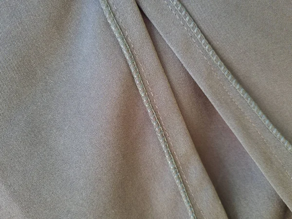 Soyut arkaplan desenli gri kumaş bir gölge oluşturmak için katlandı