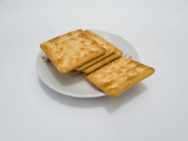 Tuzlu buğdaydan yapılmış kuru tost üzerine şeker serpiştirilmiş kraker bisküvisi denir.