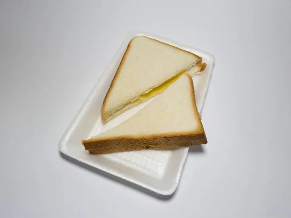 Foto Pão Branco Com Geléia Abacaxi Recipiente Branco — Fotografia de Stock