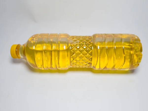 Cooking oil in bottles on a white background is usually sold in the market