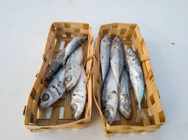 Marinated sea fish in bamboo containers and ready to be marketed