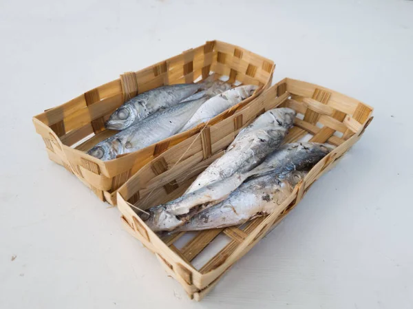 Marinated sea fish in bamboo containers and ready to be marketed
