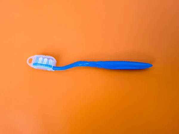 Blue Toothbrush Orange Background — Stock Photo, Image