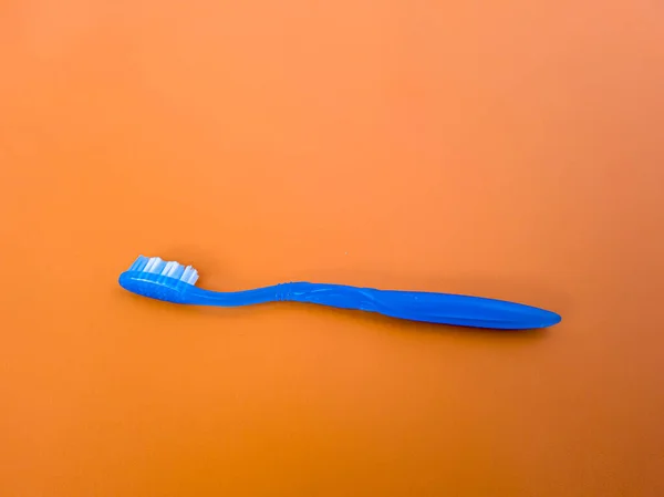 Blue Toothbrush Orange Background — Foto de Stock