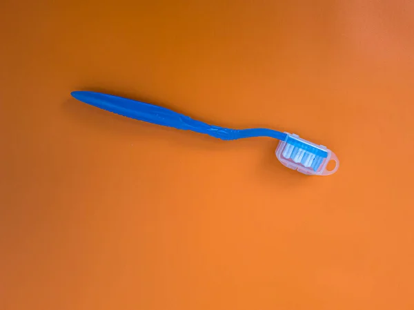 Blue Toothbrush Orange Background — 스톡 사진