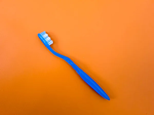 Blue Toothbrush Orange Background —  Fotos de Stock