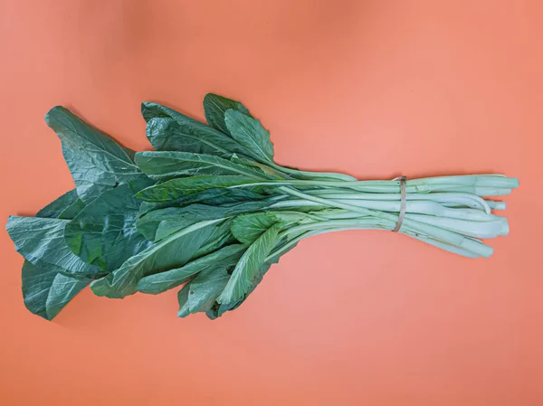 The green vegetables sold in the market are mustard greens