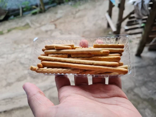 Hands Holding Light Snacks Namely Crunchy Sticks Savory Taste — Foto de Stock