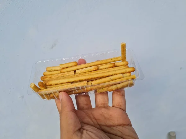 Hands Holding Light Snacks Namely Crunchy Sticks Savory Taste — Stock Fotó