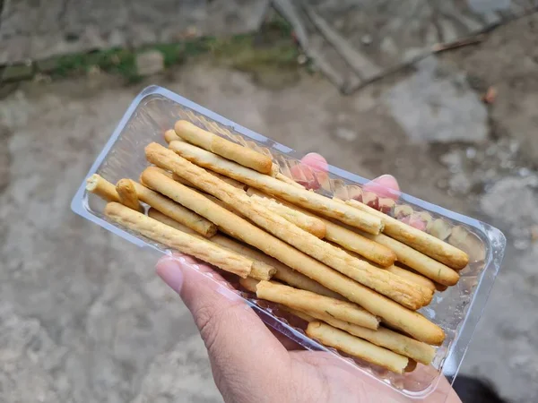 Hands Holding Light Snacks Namely Crunchy Sticks Savory Taste — Foto de Stock