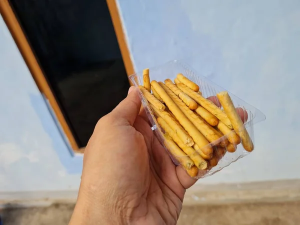 Hands Holding Light Snacks Namely Crunchy Sticks Savory Taste — 스톡 사진