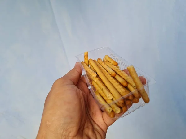 Hands Holding Light Snacks Namely Crunchy Sticks Savory Taste — Φωτογραφία Αρχείου