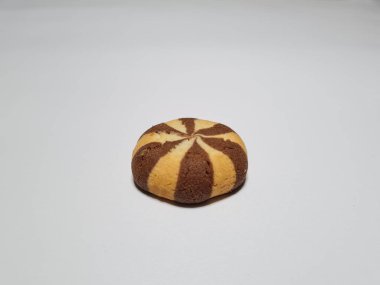 Chocolate flavored cookies in a white container