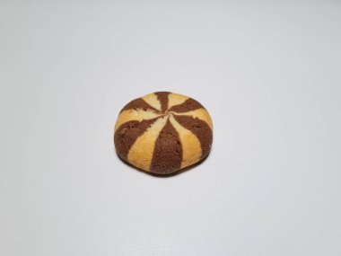 Chocolate flavored cookies in a white container