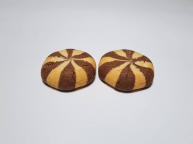 Chocolate flavored cookies in a white container