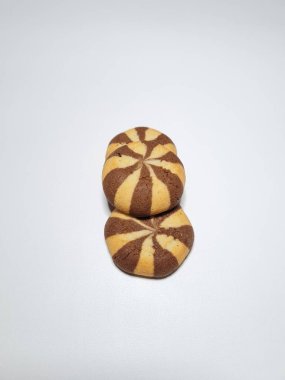 Chocolate flavored cookies in a white container