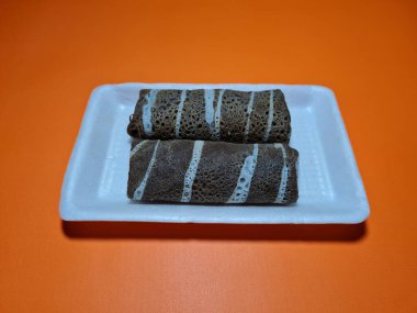 A typical Indonesian snack made from flour and other ingredients called omelet rolls sweet