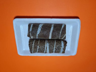 A typical Indonesian snack made from flour and other ingredients called omelet rolls sweet