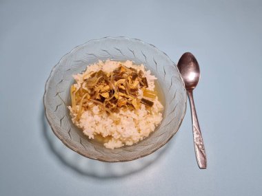 Typical Indonesian cuisine, which consists of white rice, fried chicken slices, and other toppings plus a delicious sauce, namely Soto Ayam.