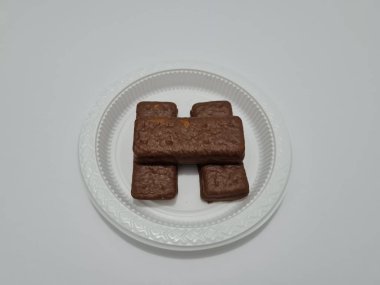 Snacks made from flour and other ingredients, namely chocolate-flavored biscuits