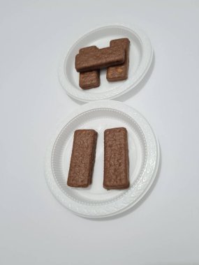 Snacks made from flour and other ingredients, namely chocolate-flavored biscuits