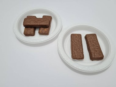 Snacks made from flour and other ingredients, namely chocolate-flavored biscuits