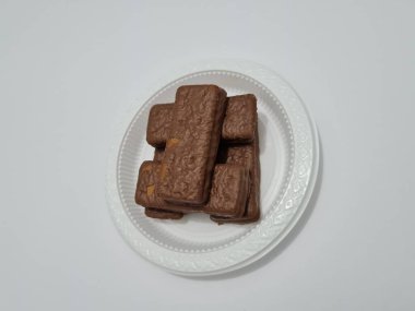 Snacks made from flour and other ingredients, namely chocolate-flavored biscuits