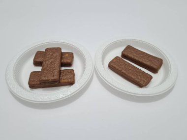 Snacks made from flour and other ingredients, namely chocolate-flavored biscuits