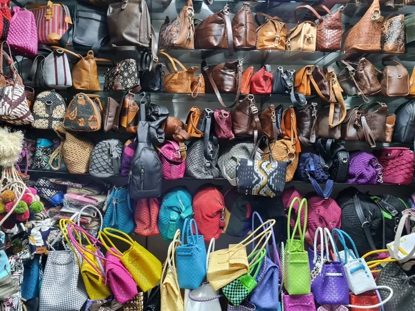 A collection of beautiful bags that are sold in the market are attached