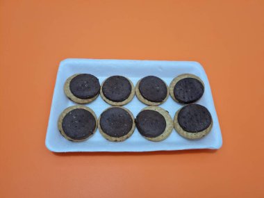 Biscuits made from wheat filled with chocolate