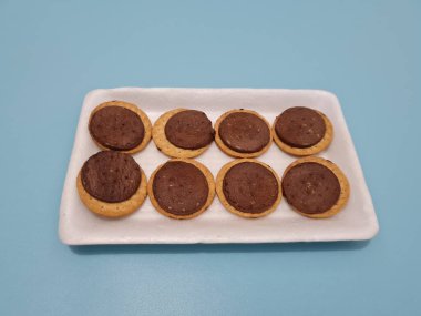 Biscuits made from wheat filled with chocolate