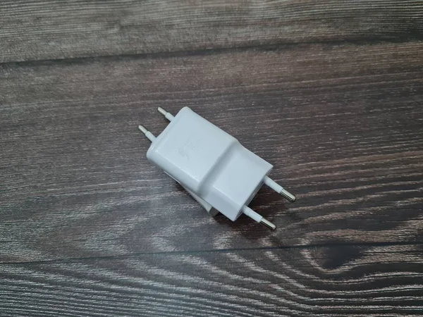 White cell phone chargers are usually used by cellphones that have run out of battery power