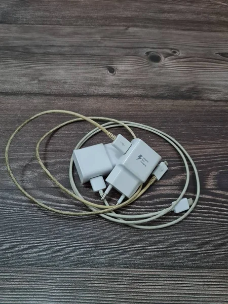 White cell phone chargers are usually used by cellphones that have run out of battery power