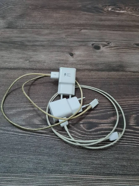 White cell phone chargers are usually used by cellphones that have run out of battery power