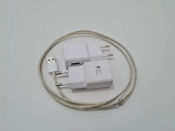 White cell phone chargers are usually used by cellphones that have run out of battery power