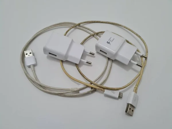 White cell phone chargers are usually used by cellphones that have run out of battery power