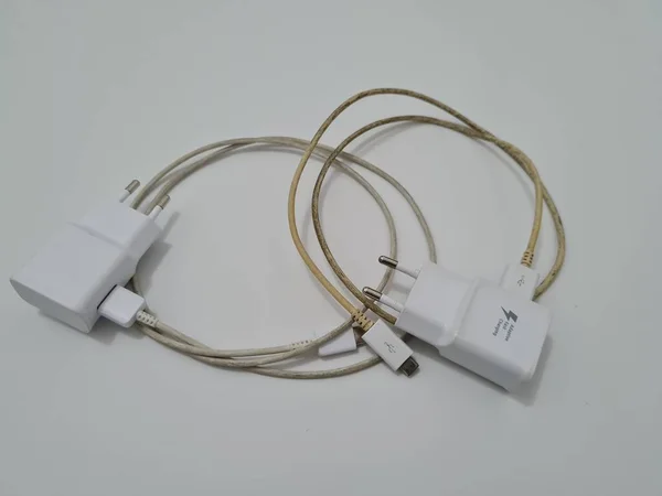 White cell phone chargers are usually used by cellphones that have run out of battery power