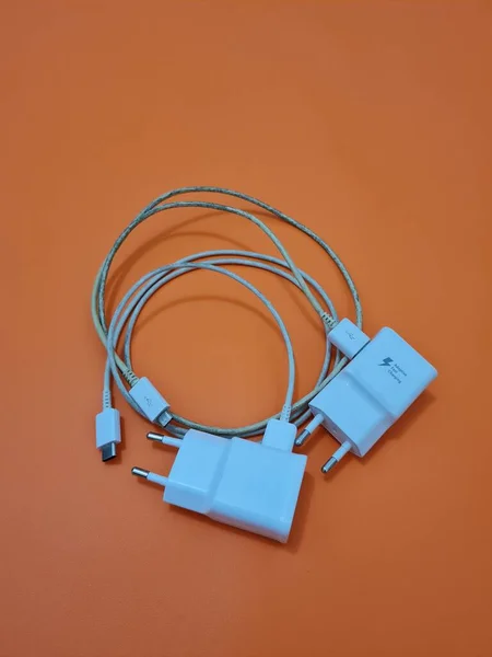 White cell phone chargers are usually used by cellphones that have run out of battery power