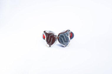 Pair of in-ear monitors without cable on an isolated white background