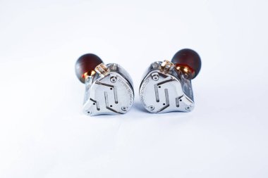 Pair of in-ear monitors without cable on an isolated white background