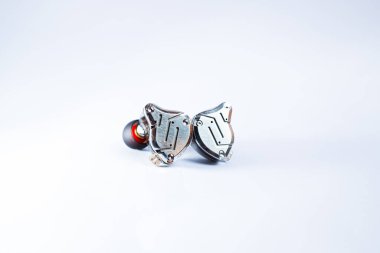 Pair of in-ear monitors without cable on an isolated white background