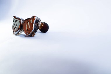 Pair of in-ear monitors without cable on an isolated white background