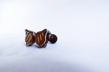 Pair of in-ear monitors without cable on an isolated white background